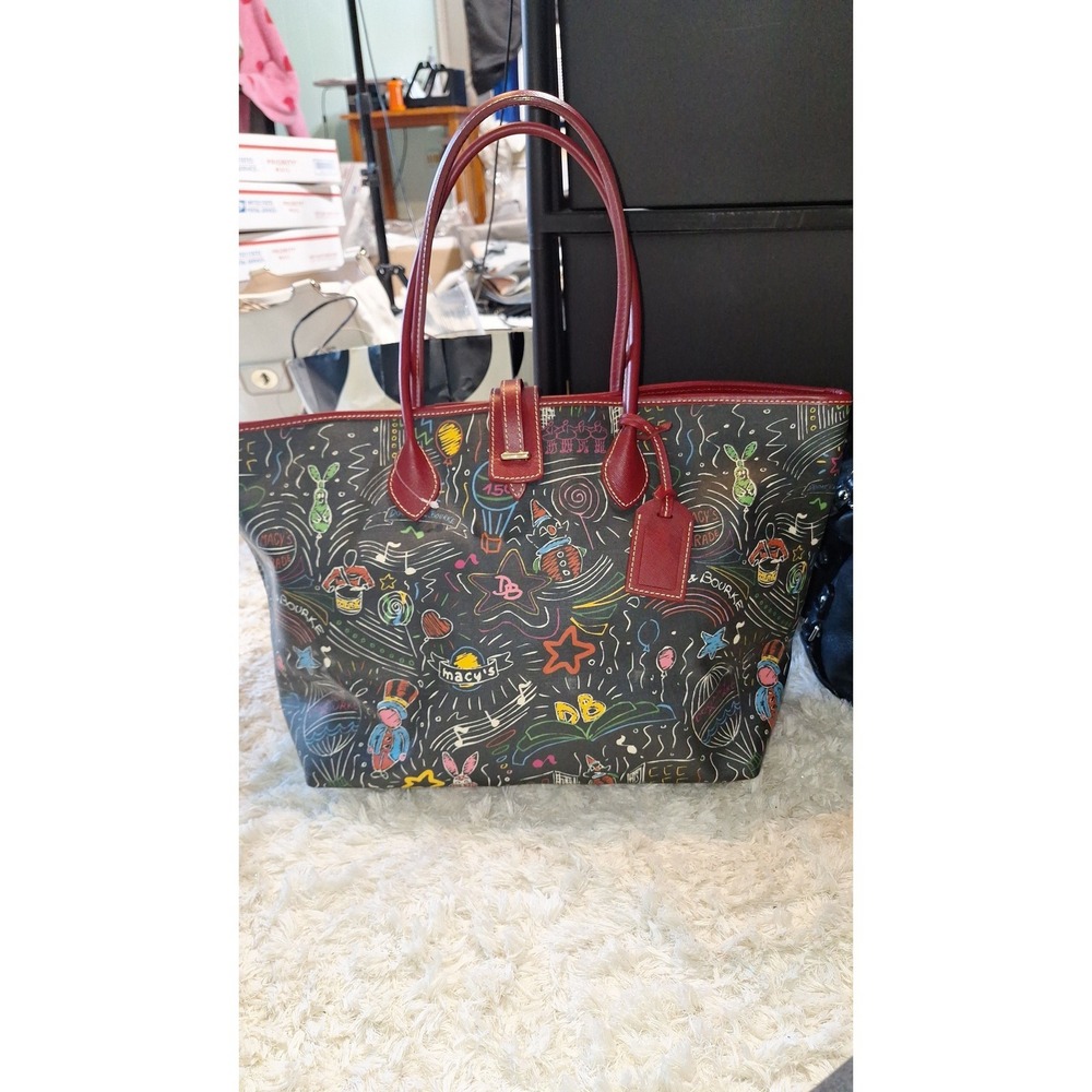 77. Dooney & Bourke Macy's Day Parade tote with a whimsical doodle style print